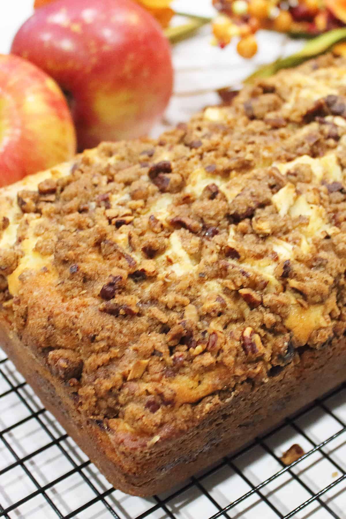 Closeup of crumbs on top of apple bread.