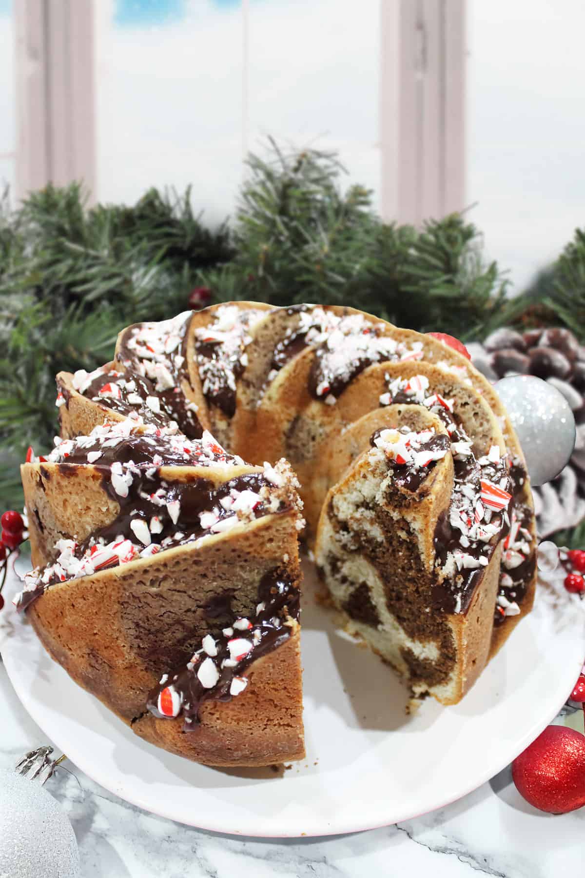 Chocolate Peppermint Marble Cake with slice out.