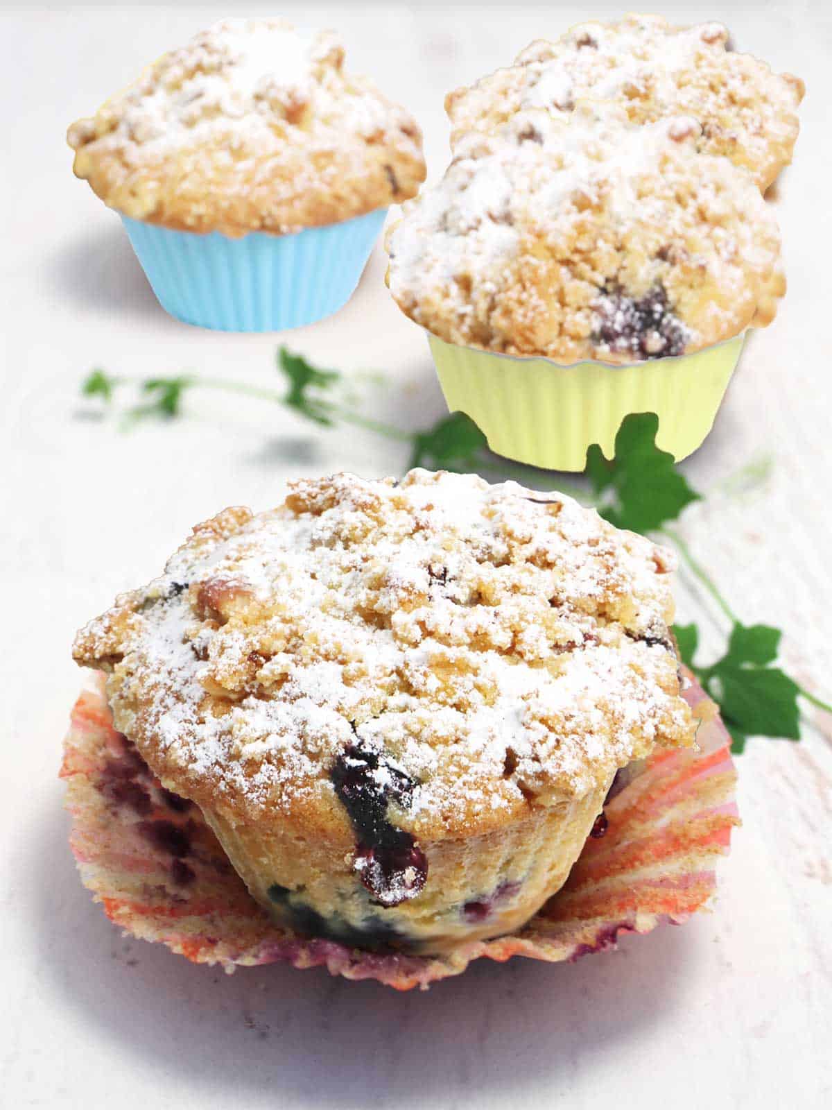 Lemon Blueberry Streusel Muffins with liner pulled back.