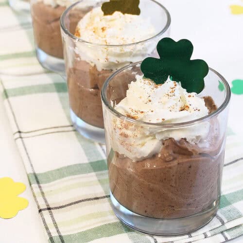 Irish Coffee Mousse with shamrock on green checkered towel.