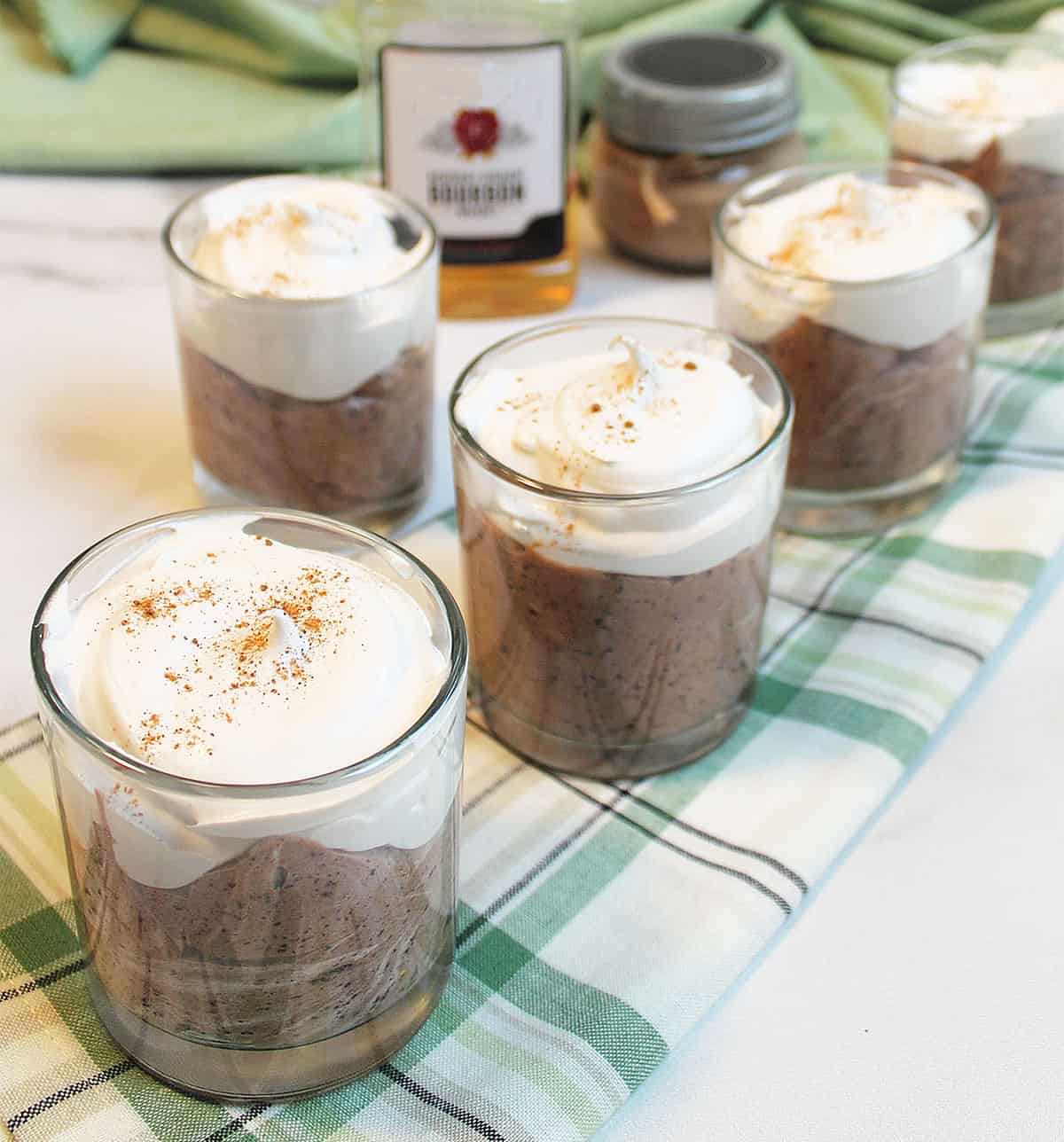 Row of Cool Whip-flavored topped mousse with nutmeg sprinkle.