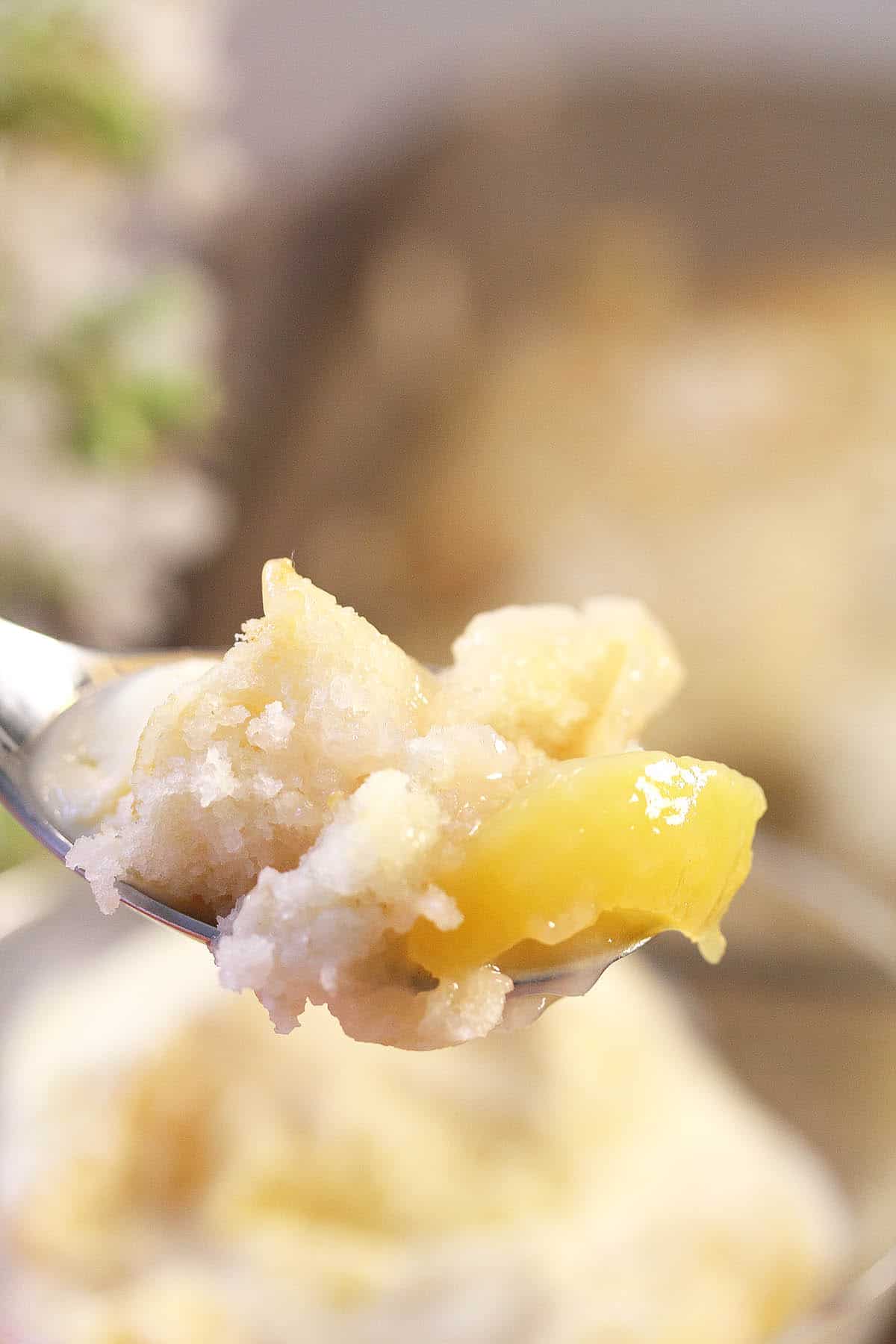 Closeup of delicious bite of cobbler on fork.