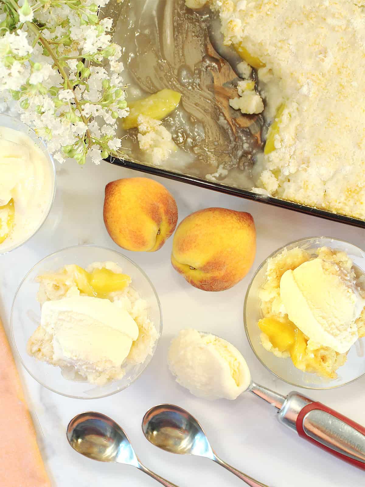 Two servings of easy peach cobbler with cake mix and sprite by casserole.