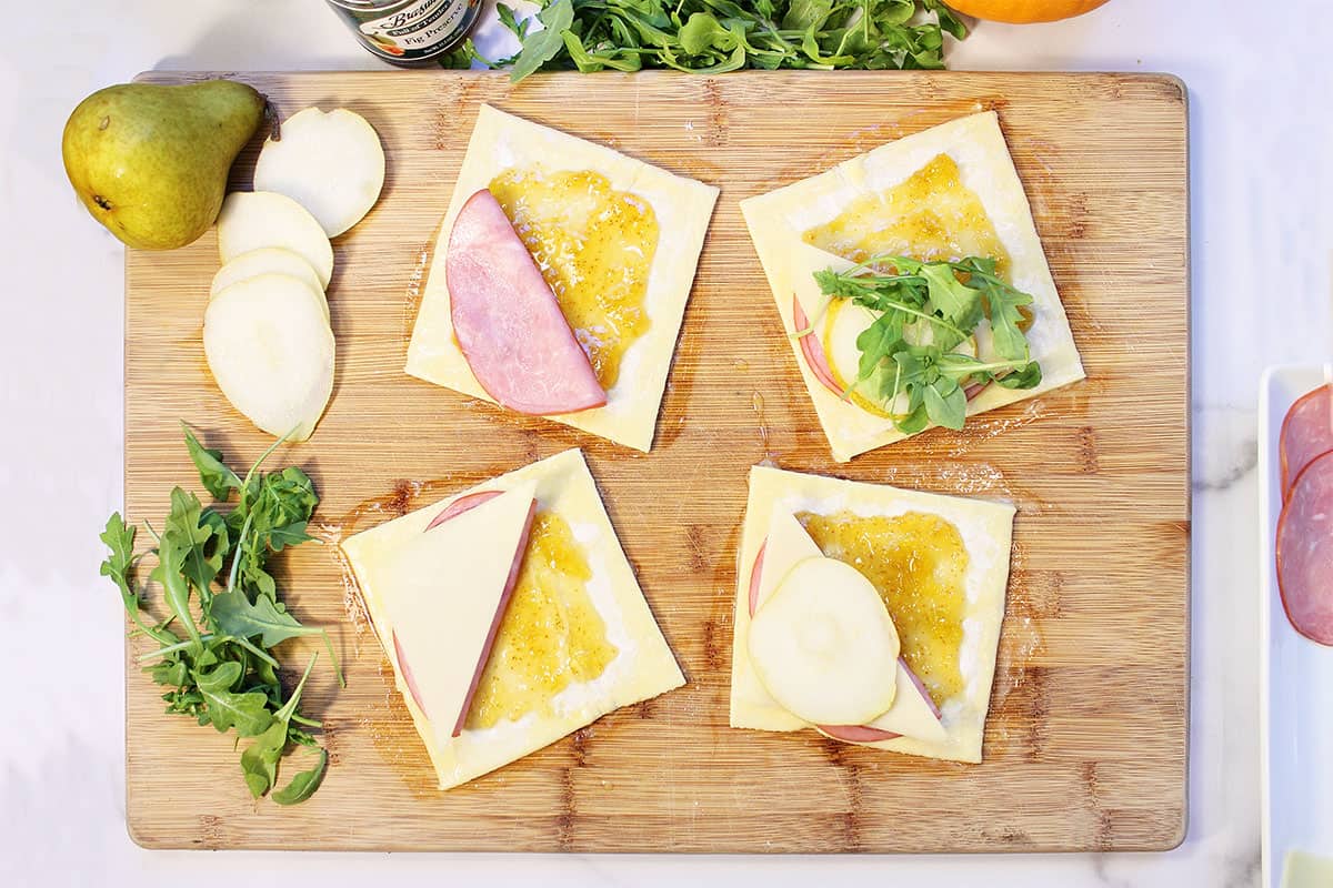 Assembling puff pastry pockets.