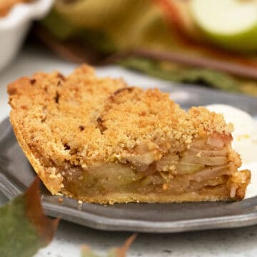 Side view of slice of apple pie showing layer of apples.