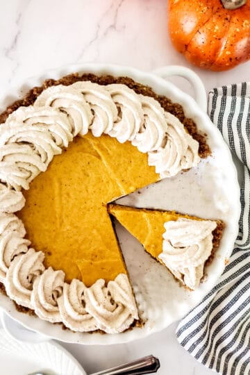 Sliced Pumpkin Chiffon Pie in pie dish.