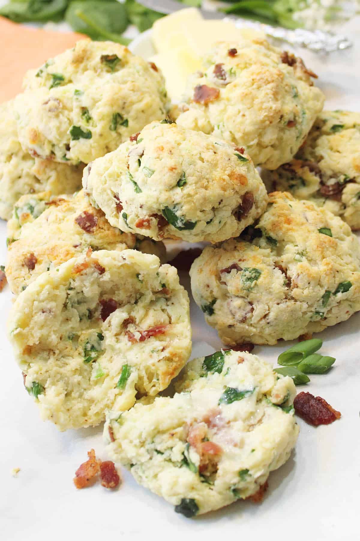 Bacon Cheddar Scones piled with halved one in front.