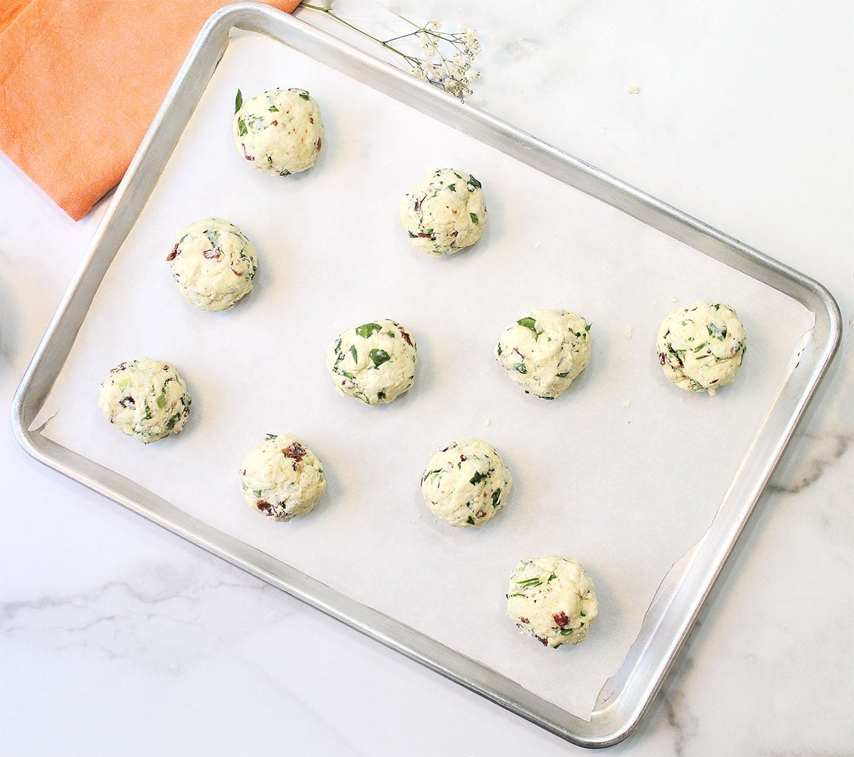 Unbaked scones on cookie sheet, ready to bake.