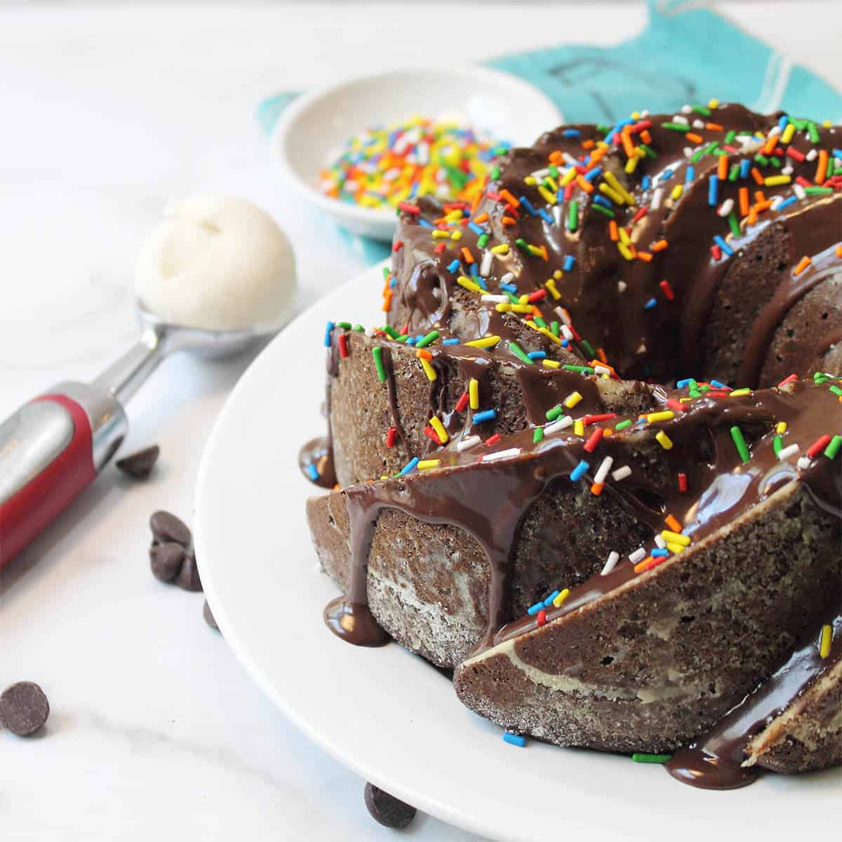 Partial view of cake with scoop of ice cream beside it.