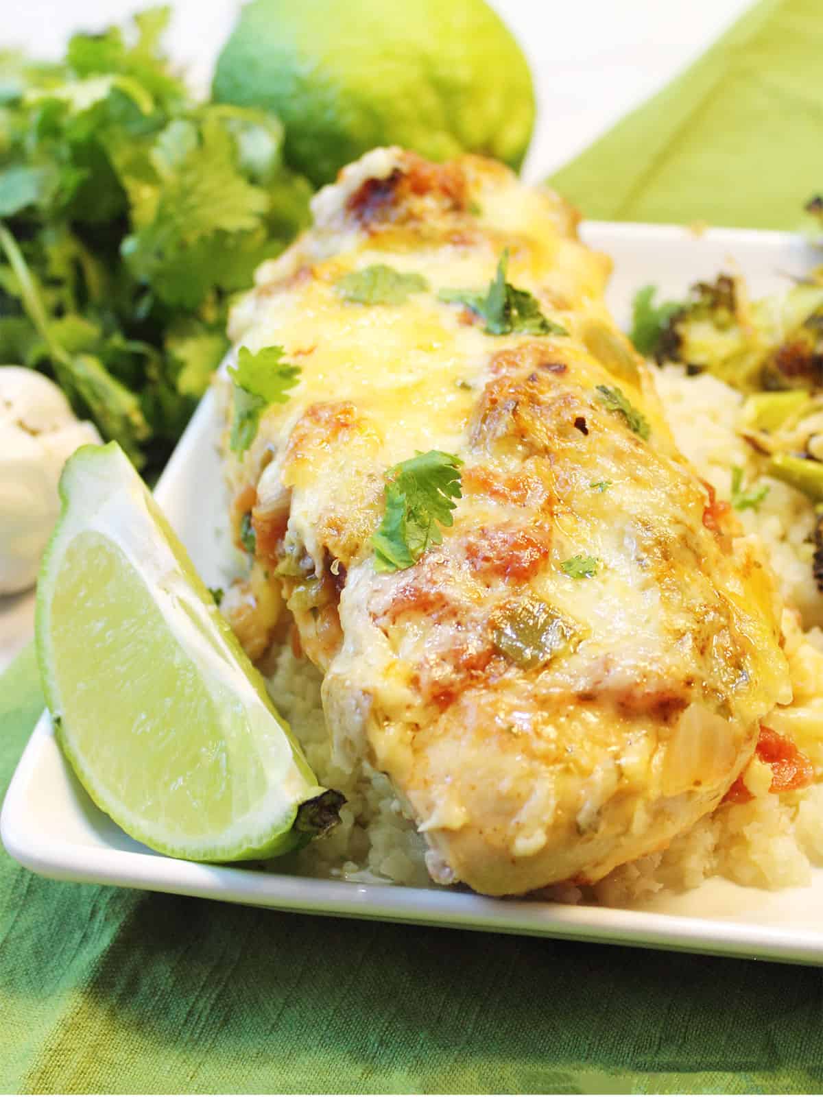 Plated Baked Salsa Chicken dinner with lime slice.