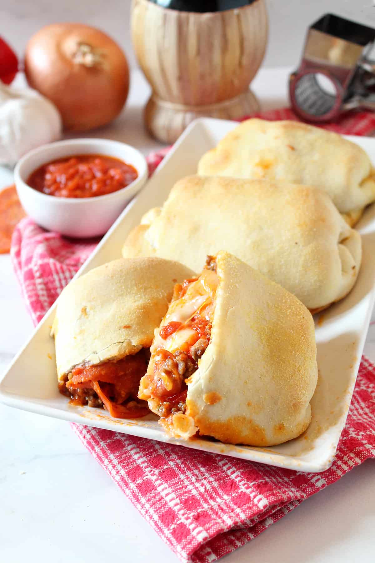 Platter of stromboli with front one halved.