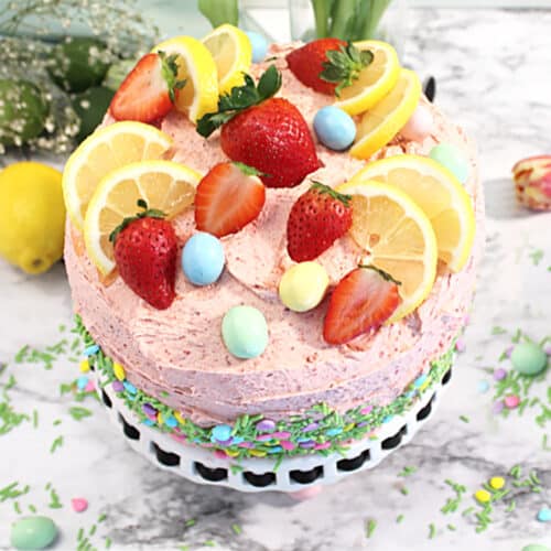 Overhead showing fruit decoration on top of lemon and strawberry cake.