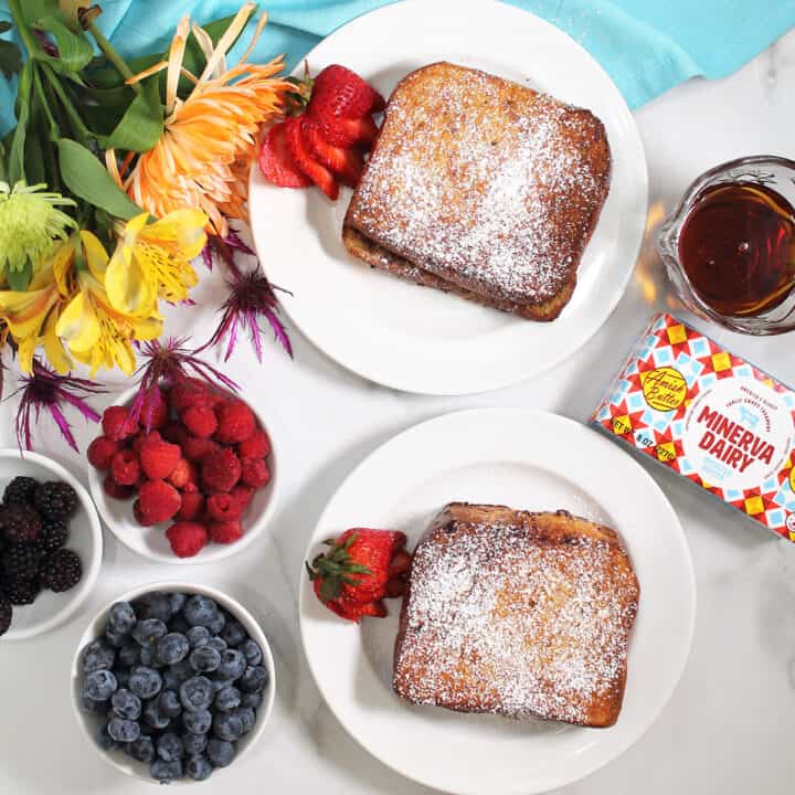 Overhead of French Toast with Minerva butter and berries on side.