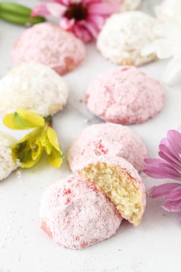 Pink butter cookie with bite out.