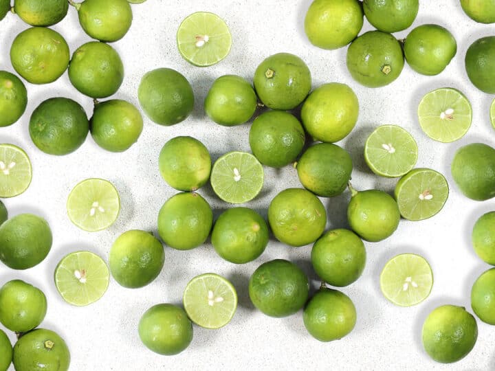 Key Limes scattered on table.