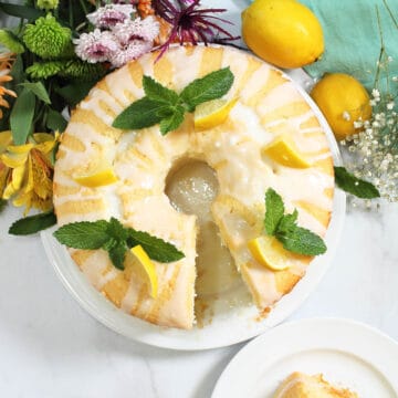 Overhead of decorate lemon cake with slice out.