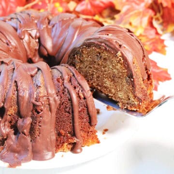 Lifting a slice of cake with server.