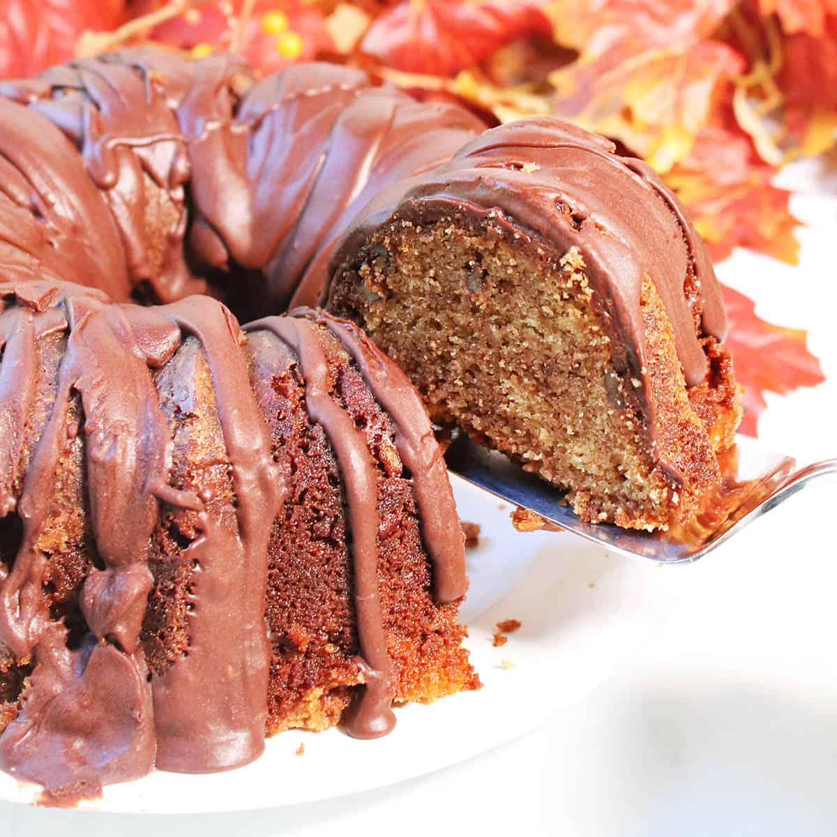 Lifting a slice of cake with server.