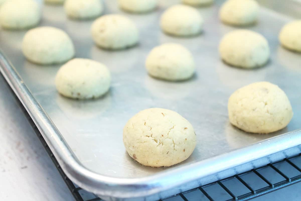 Baked brazil nut cookies on cookie sheet.
