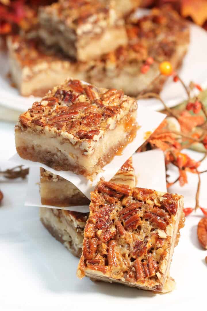 Cut bars stacked with parchment paper in between.