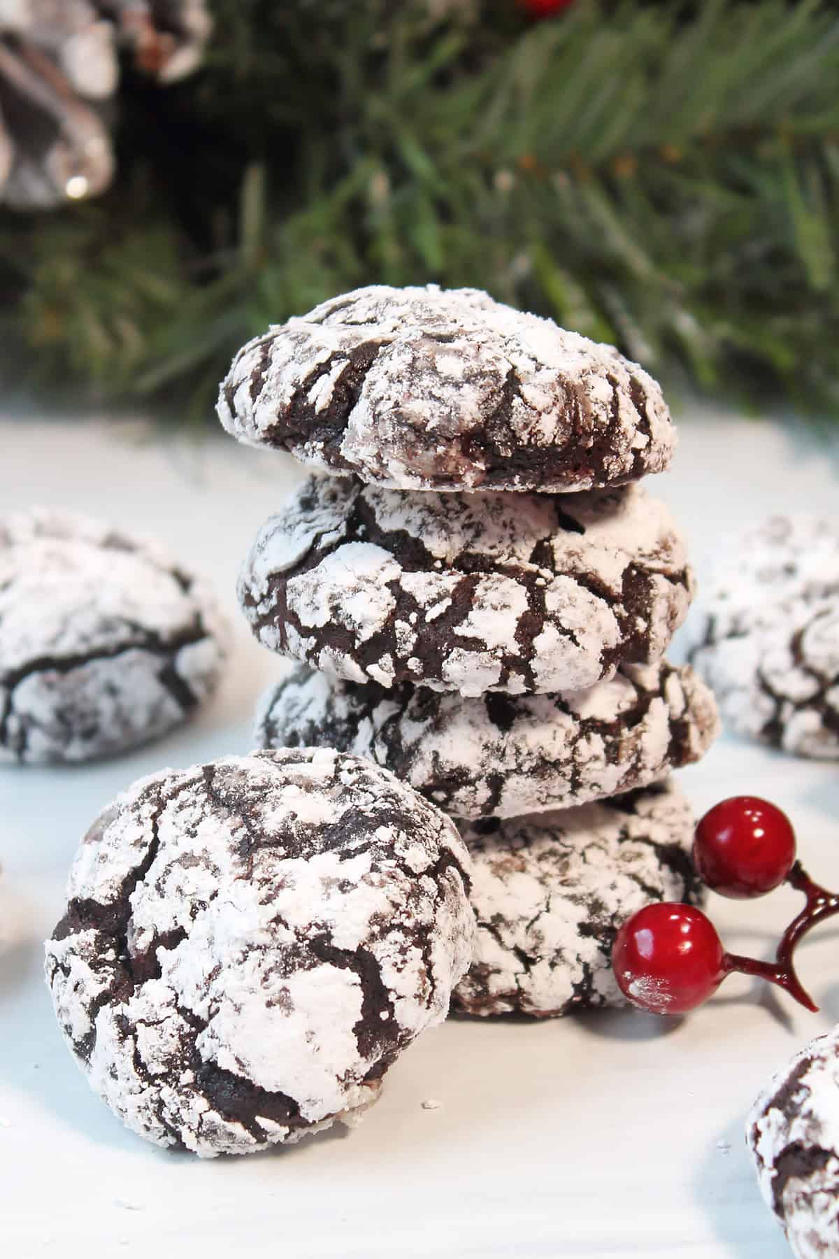 Stacked double chocolate crinkle cookies.