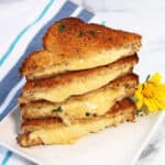 Air Fryer Grilled Cheese stacked on plate.