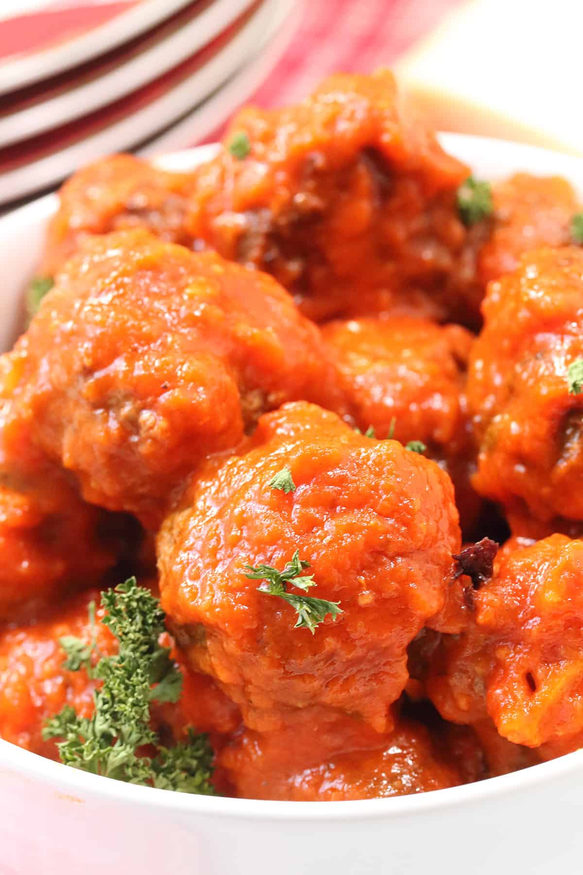 Closeup of Italian Meatballs covered in marinara.