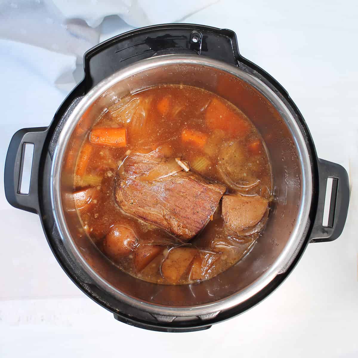 Cooked pot roast in crockpot.