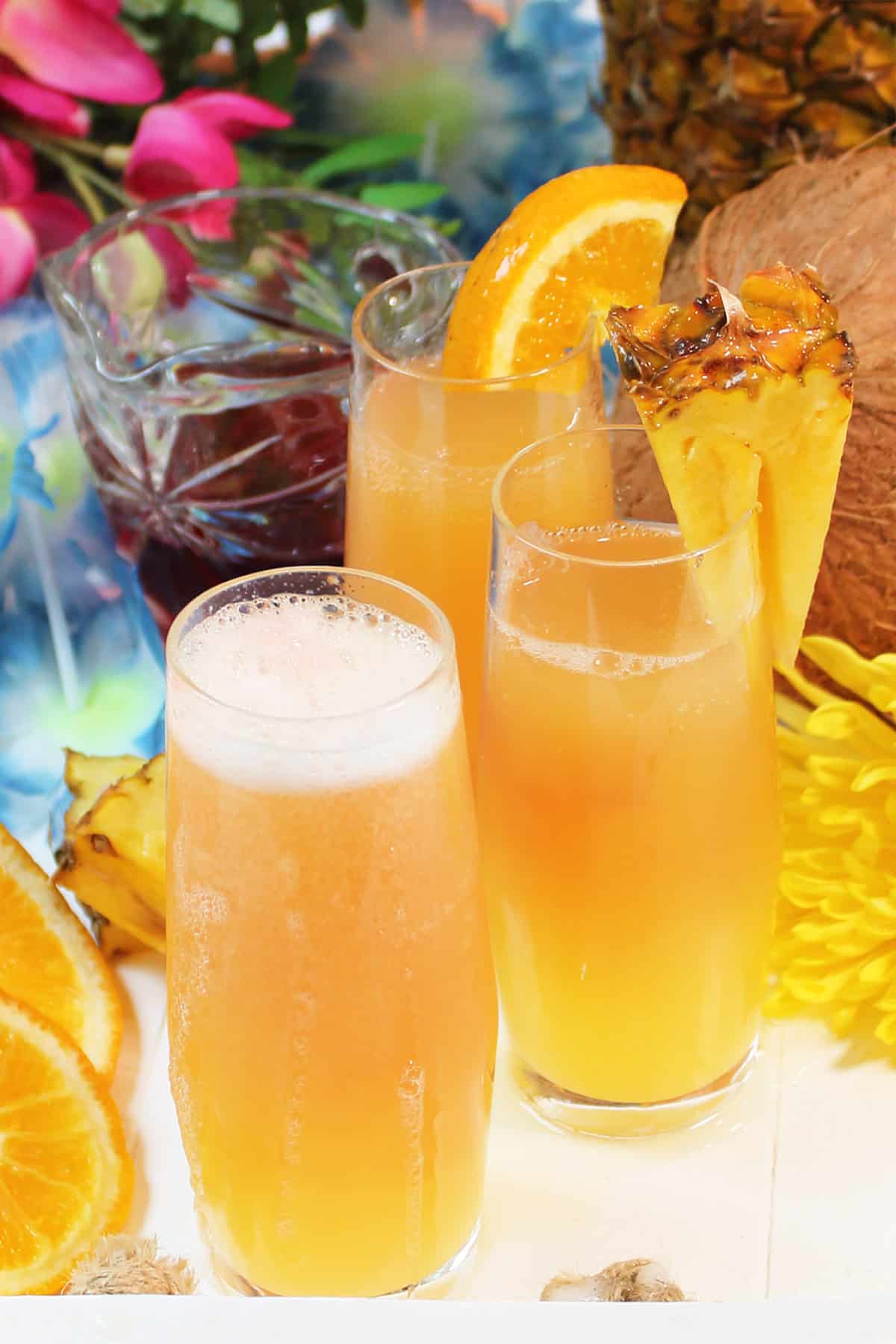 Three Hawaiian Pineapple Mimosas on white tray.