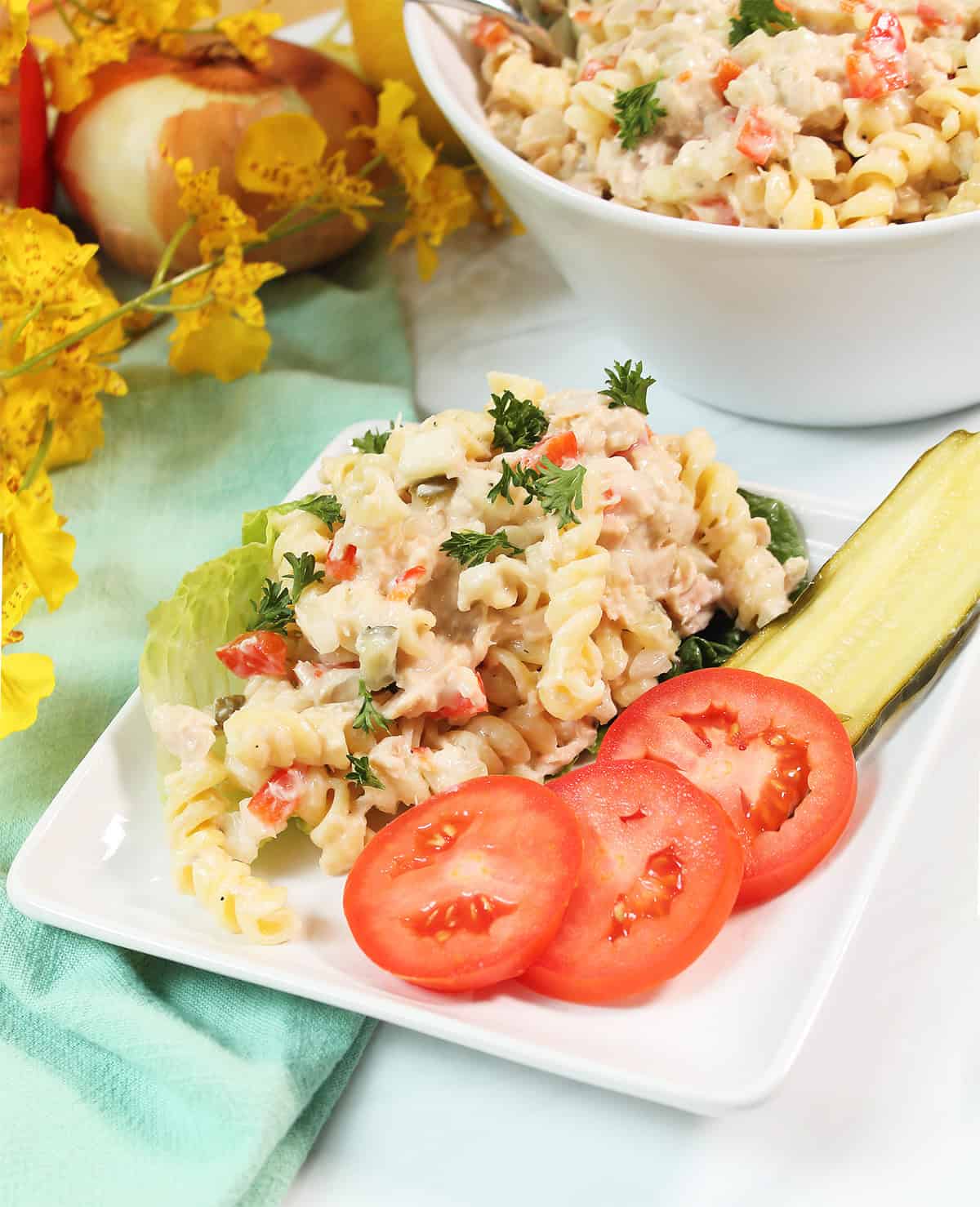 Tuna Salad Pasta on plate with tomatoes.