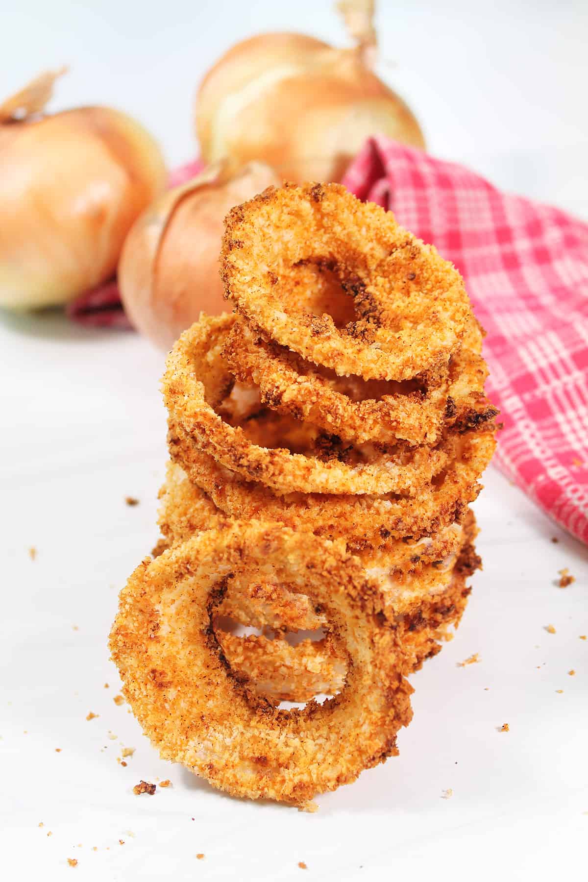 Stack of air fried onion rings.