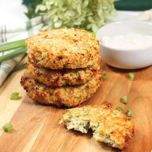 Air Fryer Zucchini Fritters on wooden board.