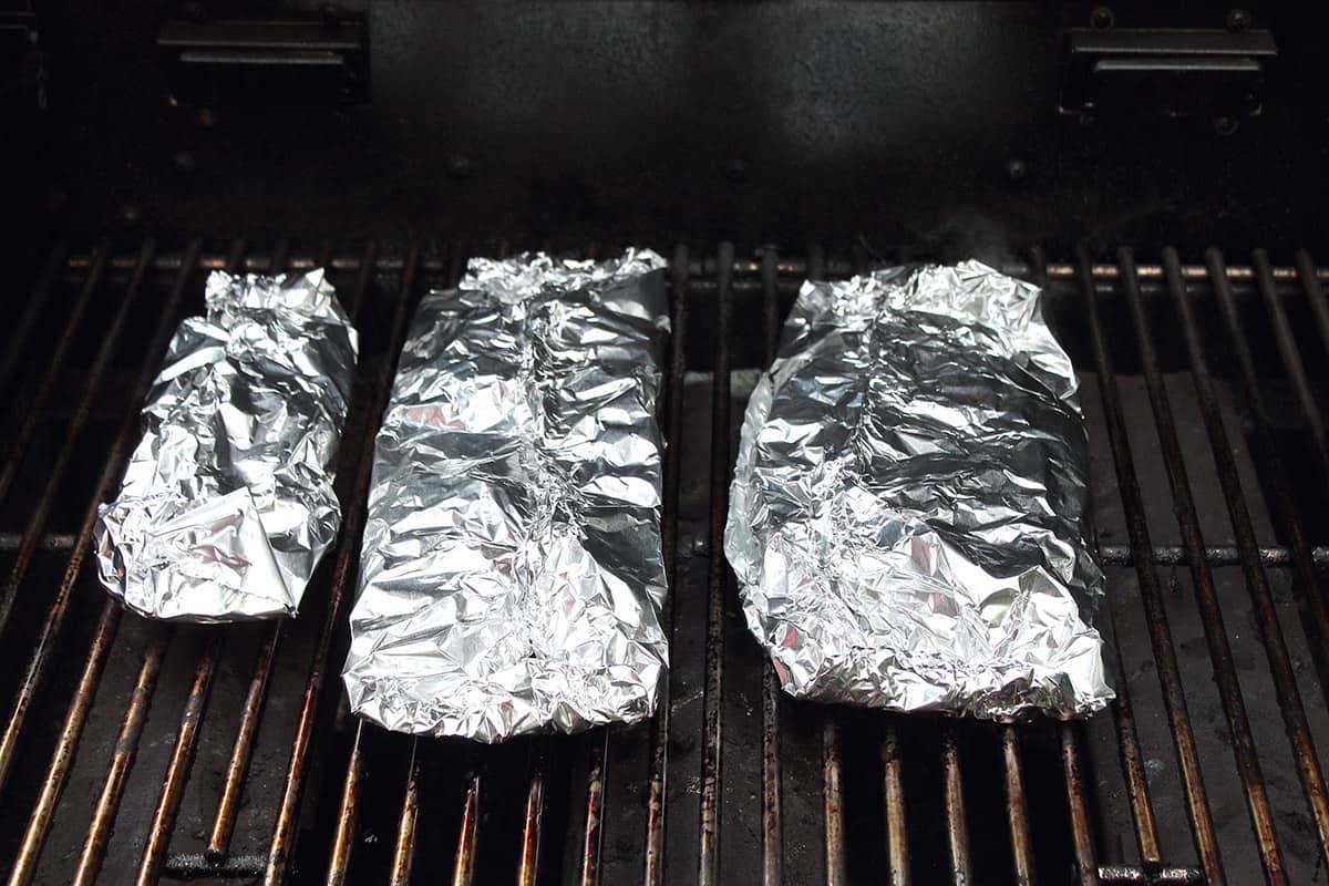 Grilling fish on gas grill.