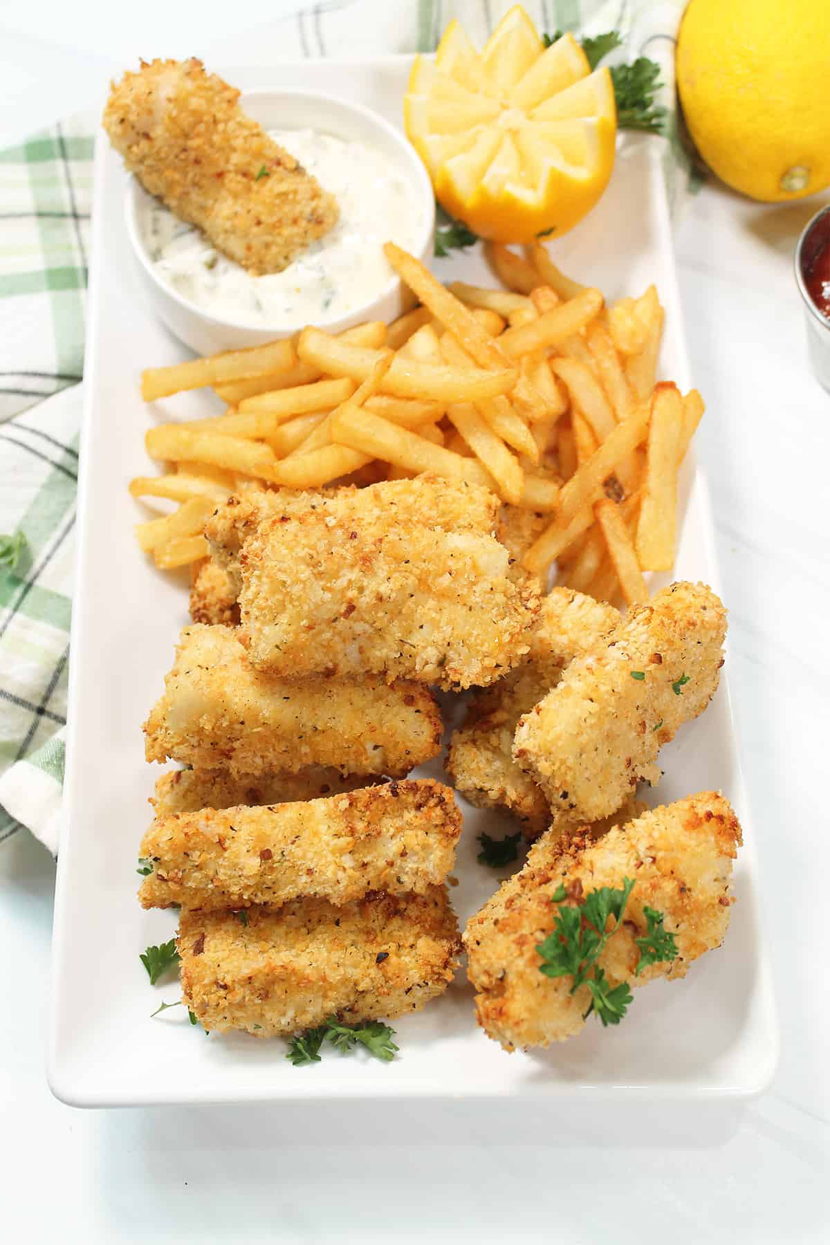 Dinner of fish sticks with French fries.