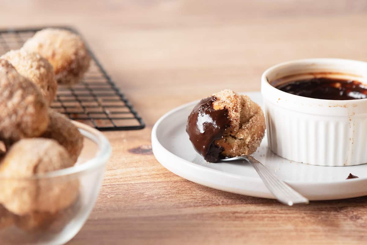 Donut hole dipped in chocolate.