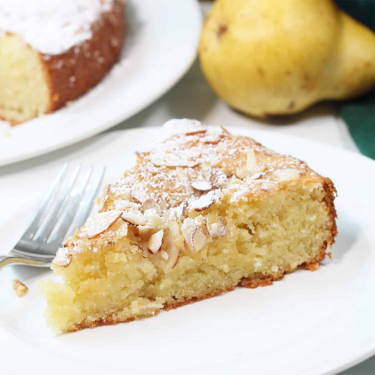 Closeup of slice of  cake on plate with fork.