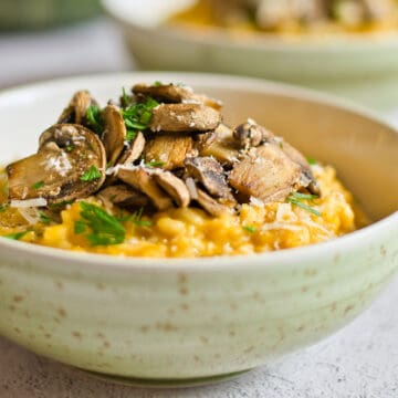 Highlight of mushrooms on top of risotto.