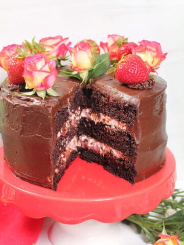 Sliced chocolate cake showing strawberry filling.