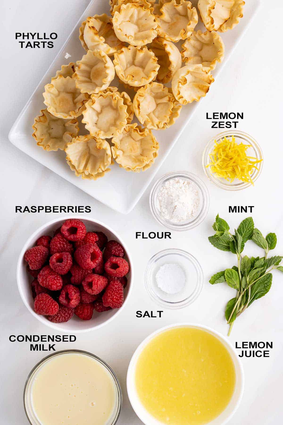 Labeled ingredients for tarts on table.