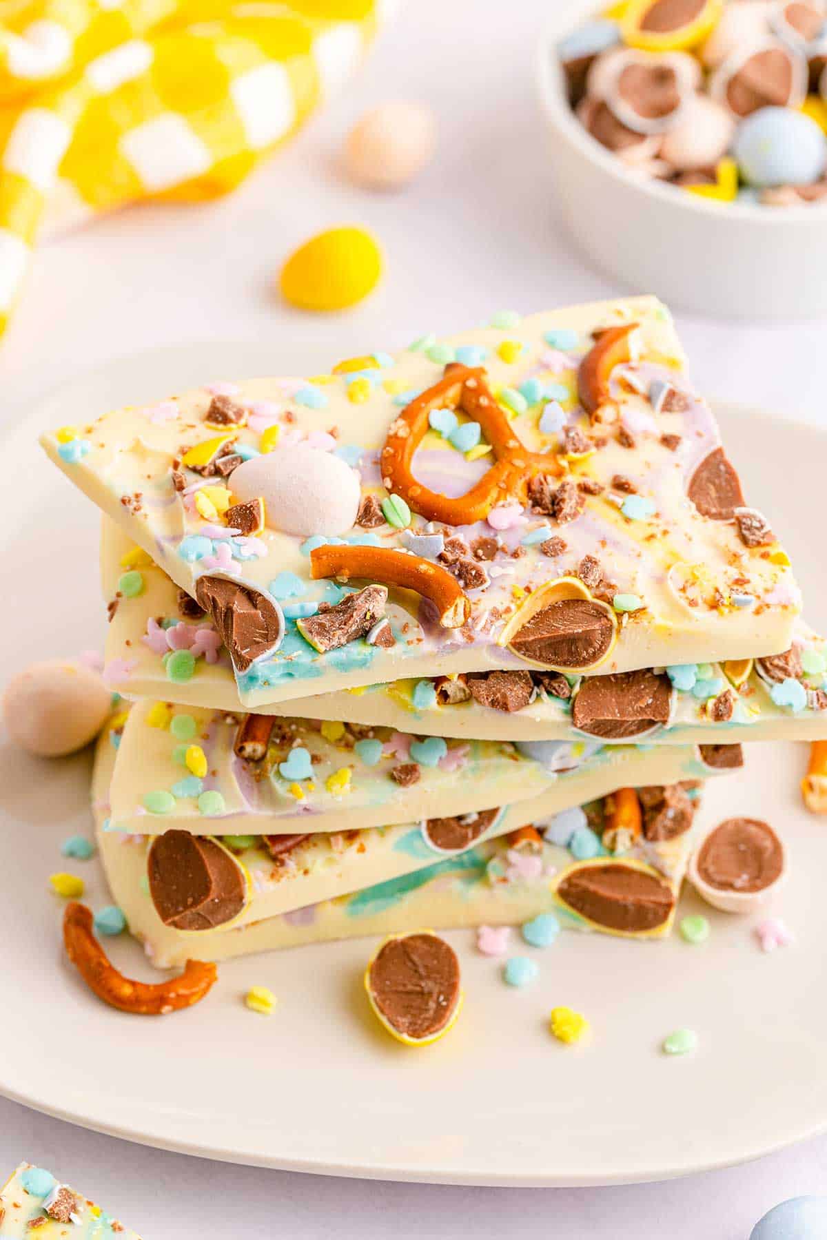 White Chocolate Easter Bark stacked on plate.