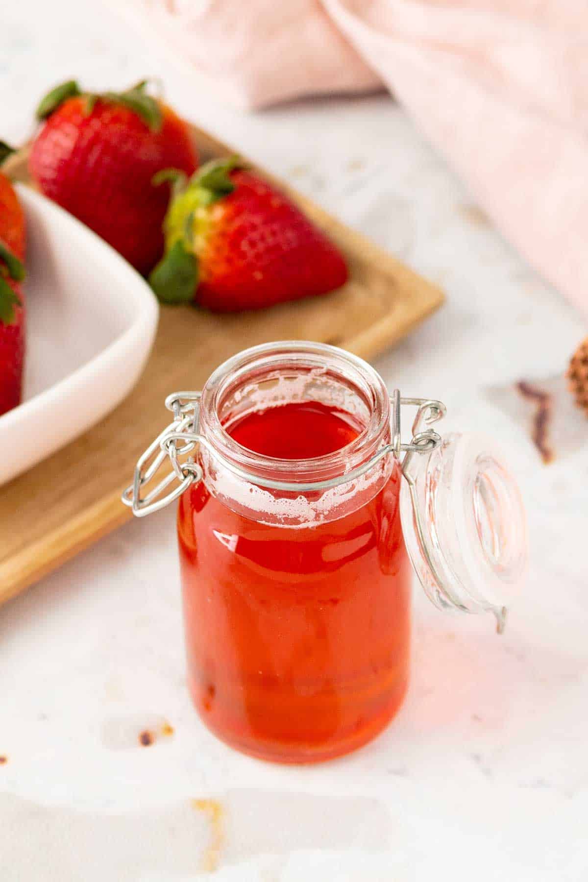 Looking down into warm syrup in jar.