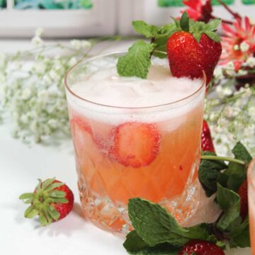 Closeup of garnished strawberry cocktail.