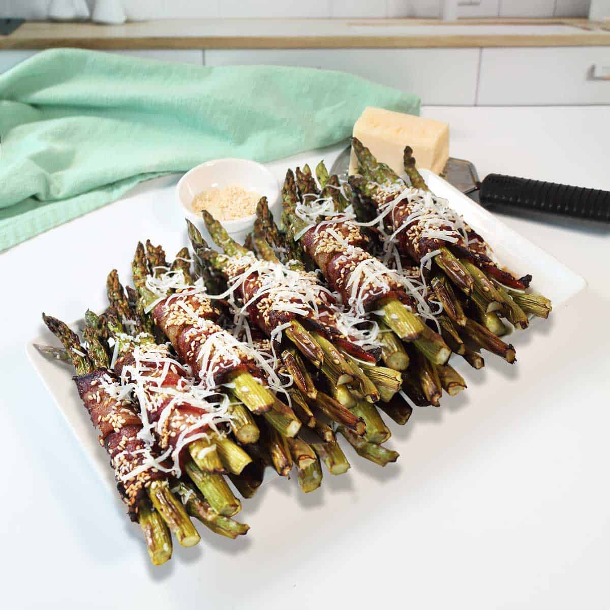 Air fryer asparagus sprinkled with cheese.
