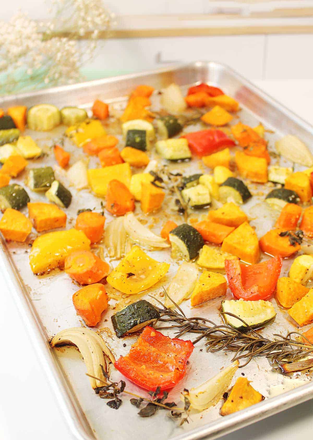 Roasted vegetables on baking sheet.