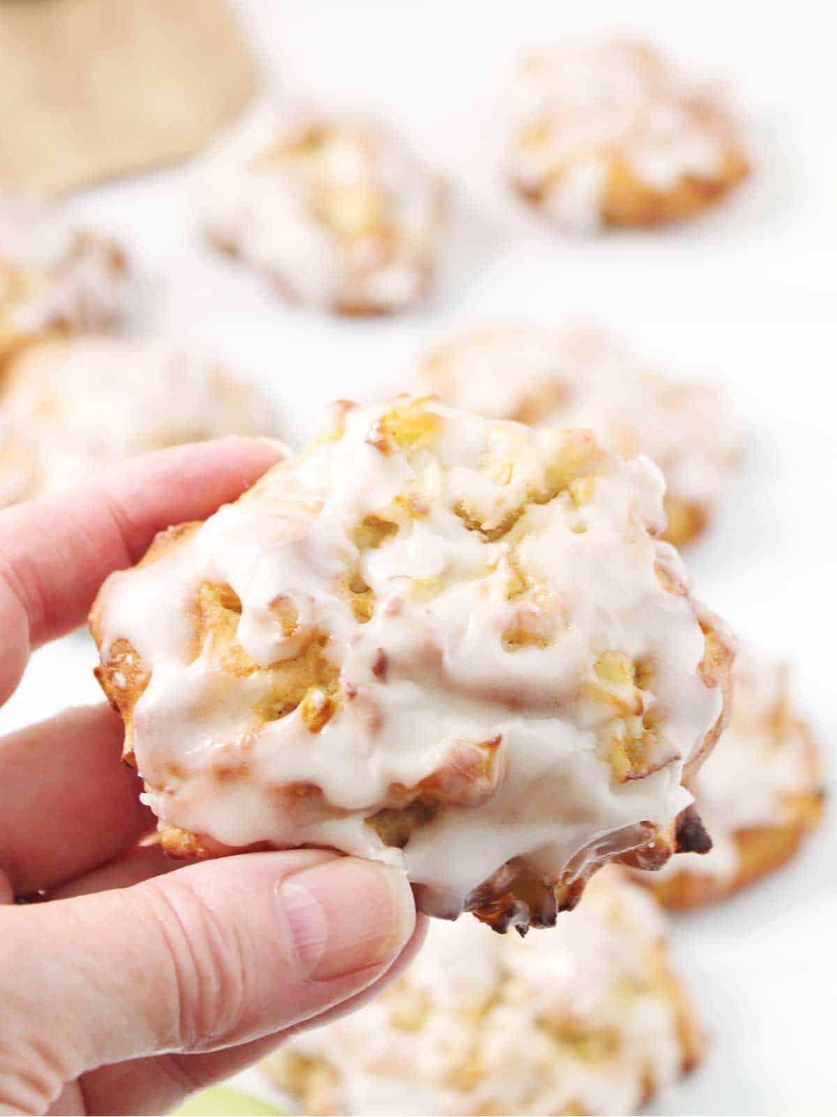 Closeup holding apple fritter.