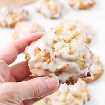 Closeup holding a warm homemade apple fritter.