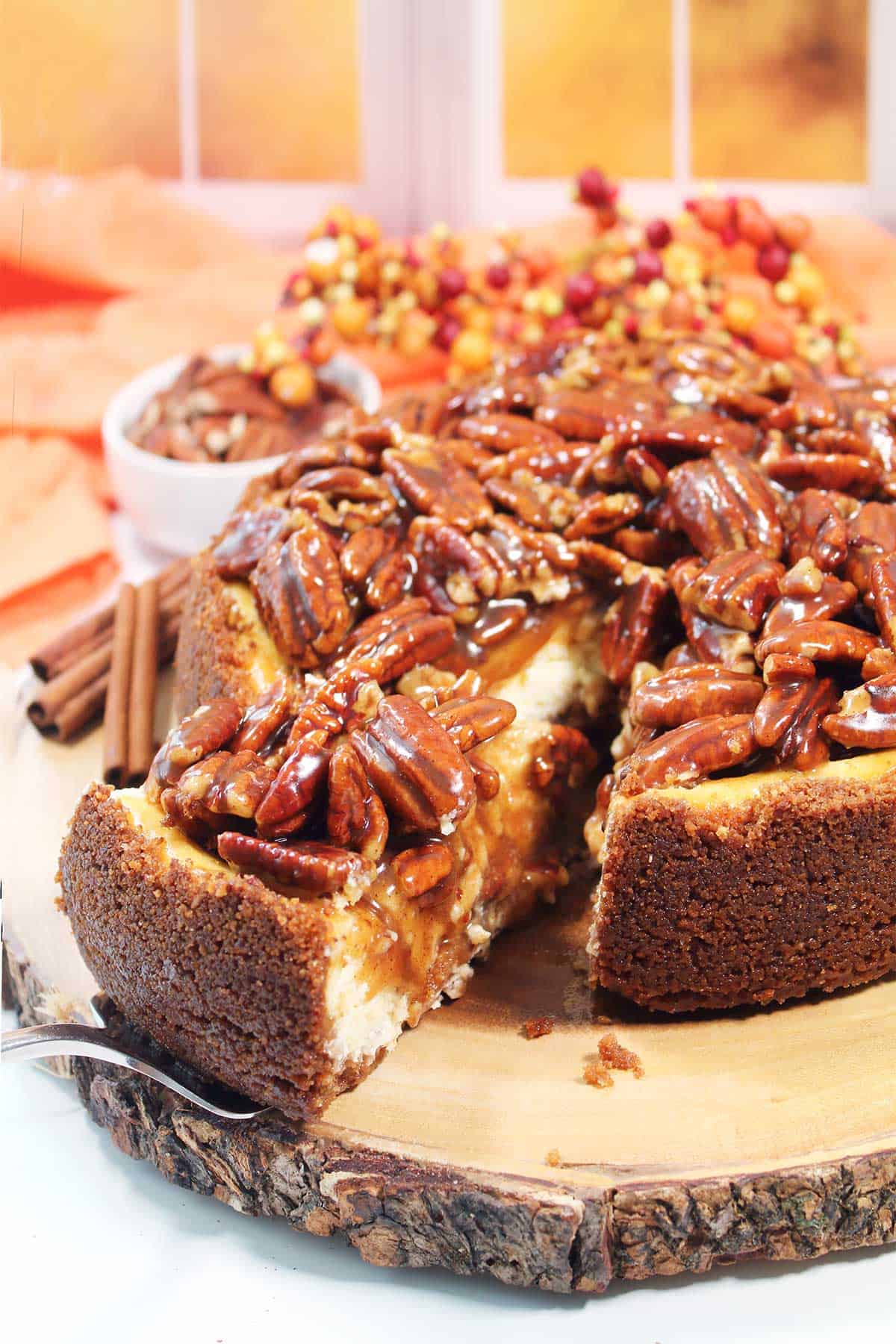Lifting slice out of pecan cheesecake.
