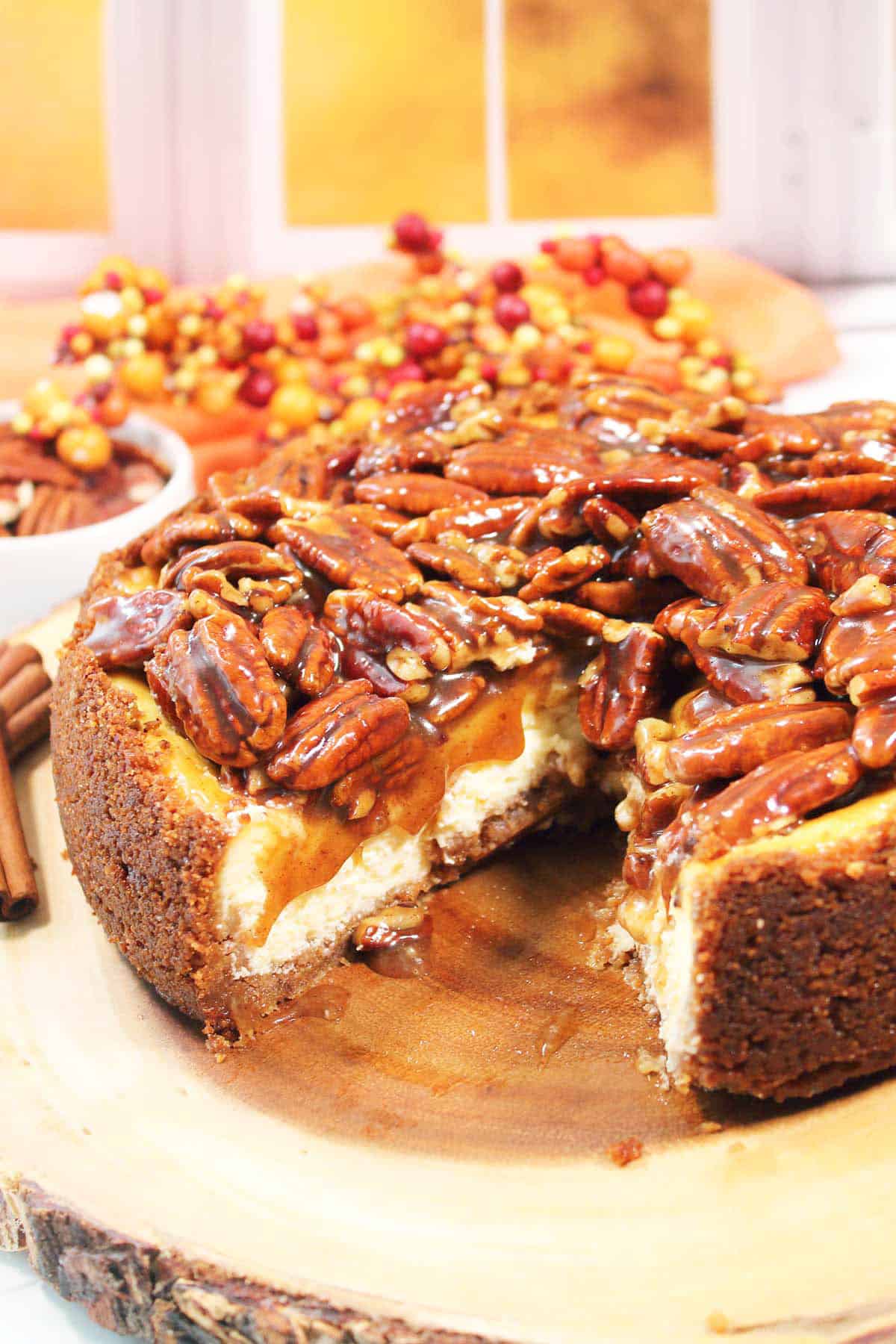 Pecan Pie Cheesecake with slice out.