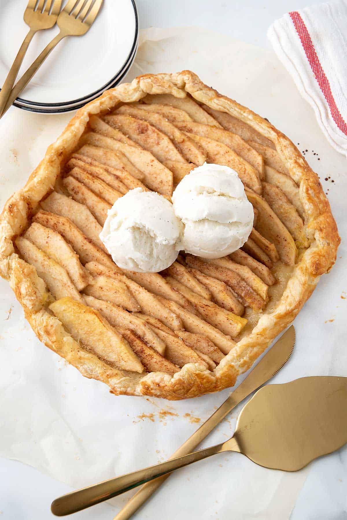 Overhead of apple galette with two scoops of ice cream.