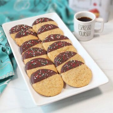 Coffee cookies on platter with cup of espresso.